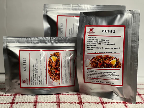 Double L Ranch freeze-dried chili and rice dinners displayed on a table