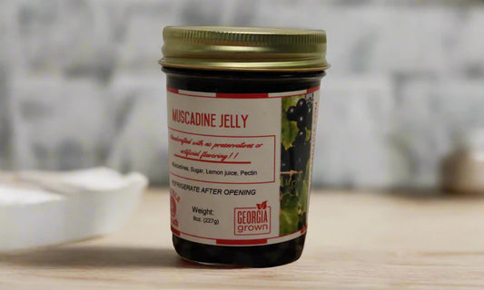 Double L Ranch Muscadine Jelly jar displayed on a table